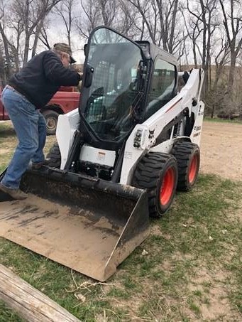 Craig with a bobcat.